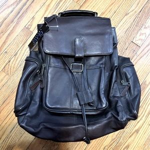 Clava Leather dark brown backpack. Never used. EUC. Tag still on. Unique style.